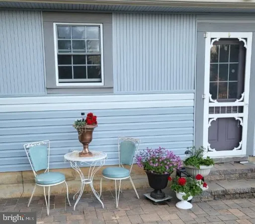 a table and chair in a patio