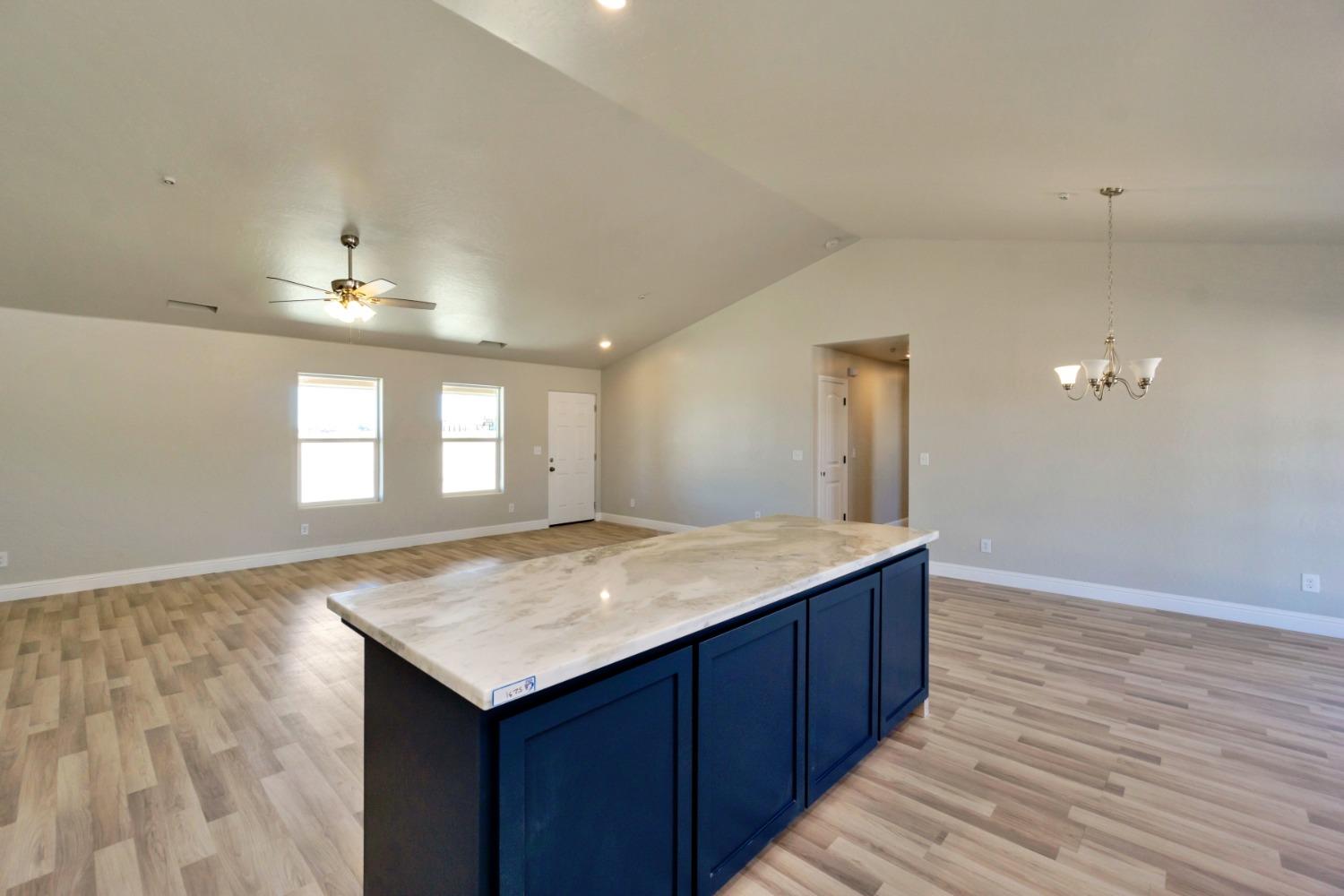 21250 Steward Road Madera, CA 93638 - Photo 11 of 40 a kitchen with a sink and cabinets