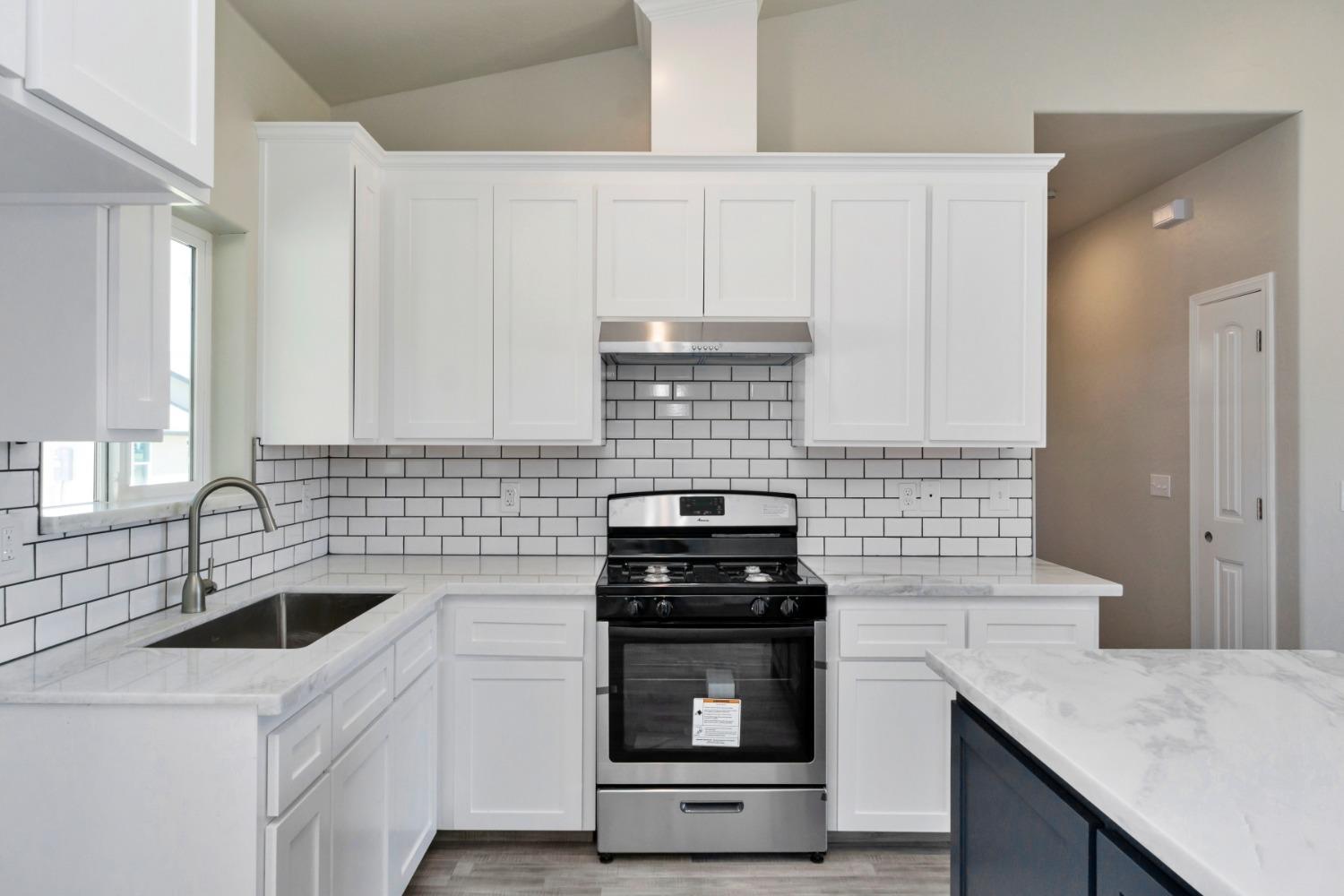 21250 Steward Road Madera, CA 93638 - Photo 28 of 40 a kitchen with a sink and cabinets