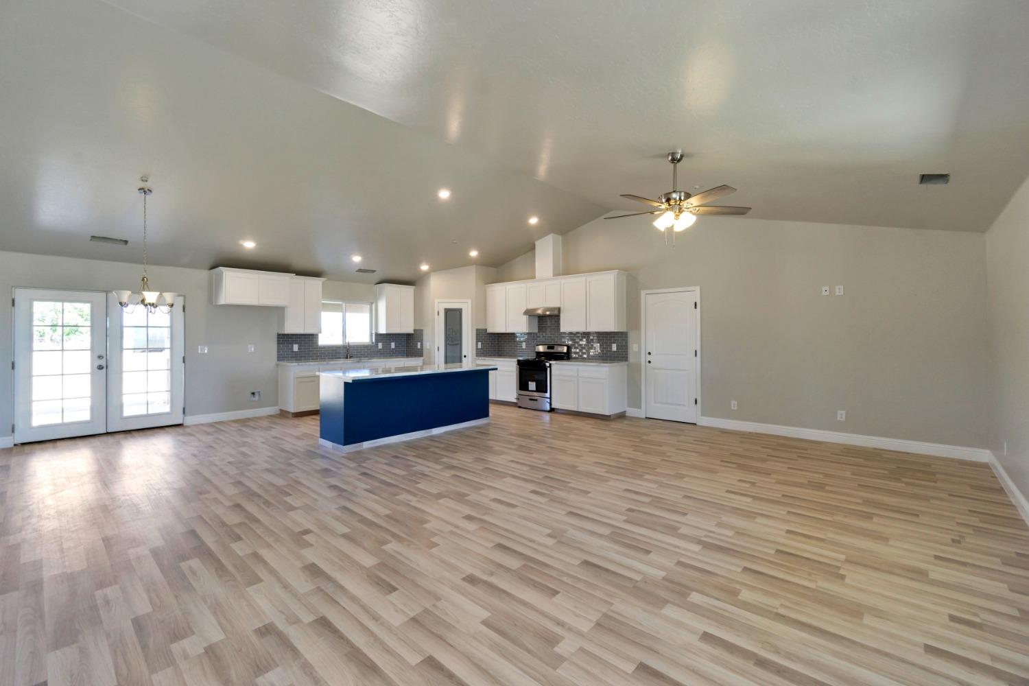 21250 Steward Road Madera, CA 93638 - Photo 6 of 40 a view of kitchen with cabinets and wooden floor