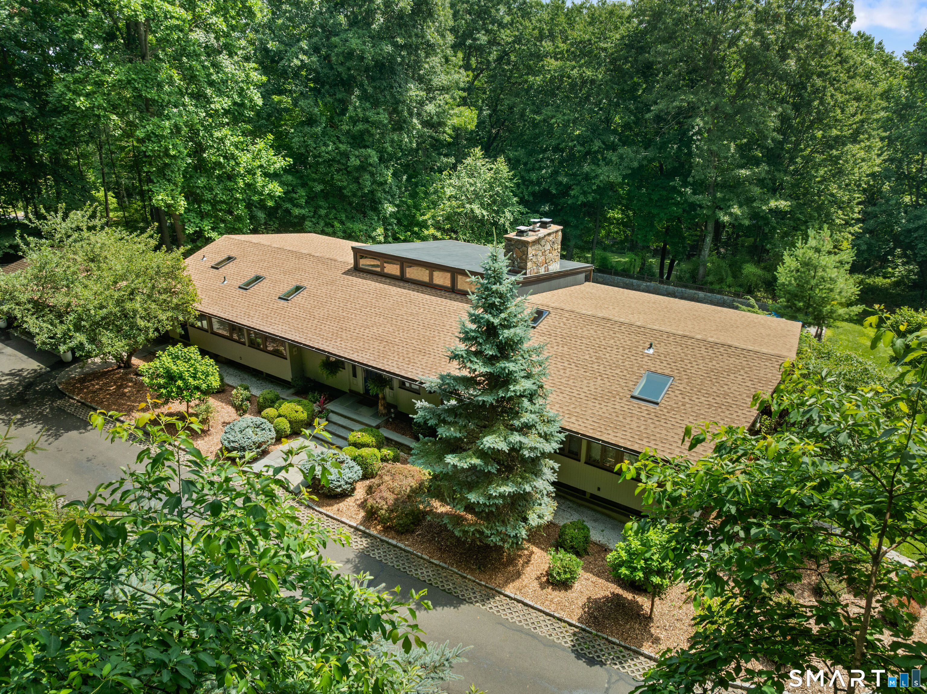 132 Signal Hill Road Wilton, CT 06897 - Photo 3 of 32 Handsome contemporary architecture set amidst a private wooded lot.