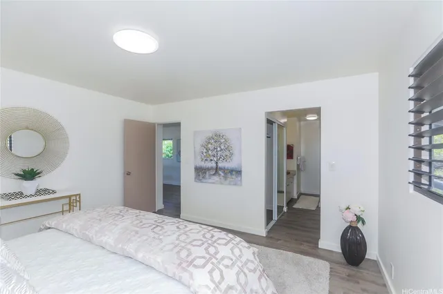 a bedroom with a bed and cabinets