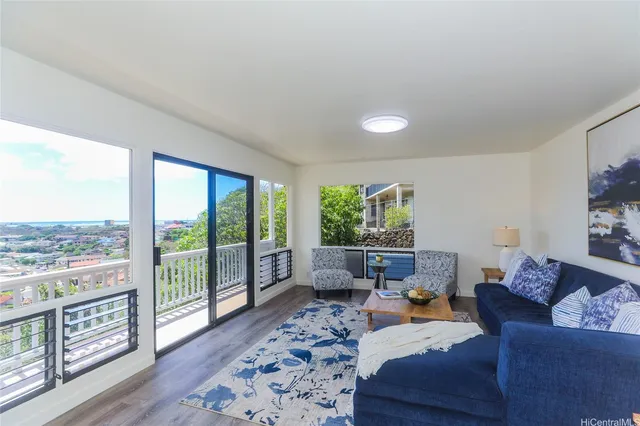 a living room with furniture and a large window