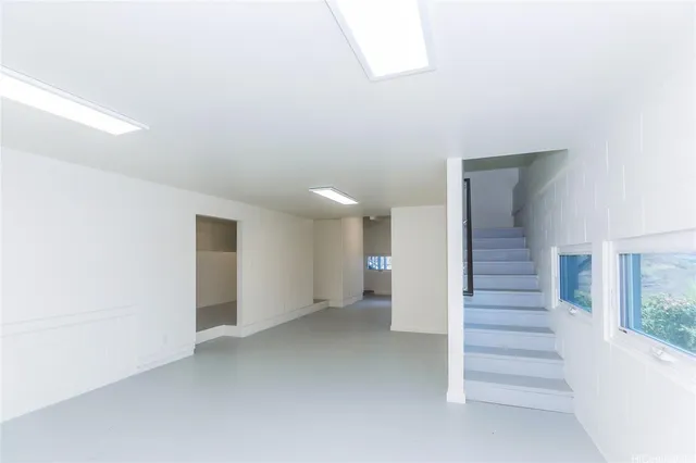 a view of an empty room with stairs