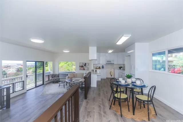 a view of a dining room with furniture window and outside view