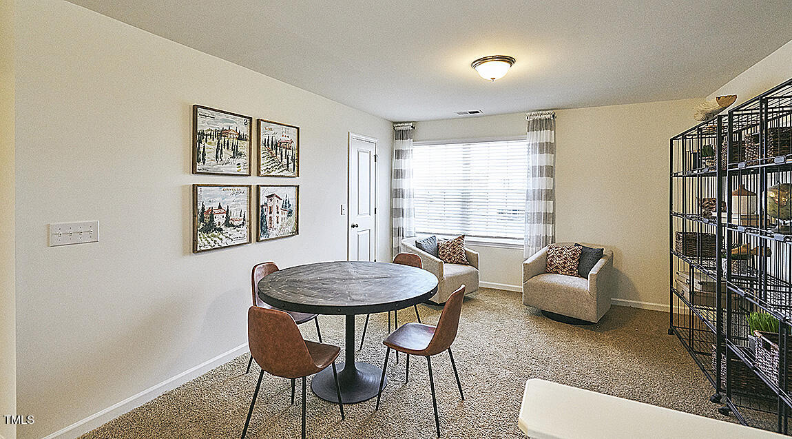 1733 Post Oak Drive Haw River, NC 27258 - Photo 19 of 26 a living room with furniture and a large window