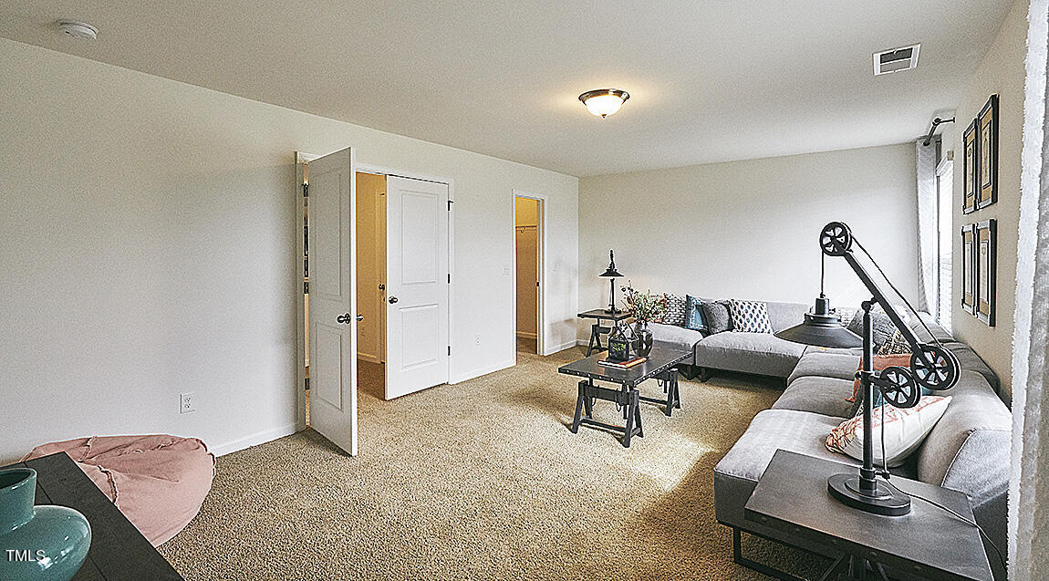1733 Post Oak Drive Haw River, NC 27258 - Photo 24 of 26 a living room with furniture and a flat screen tv