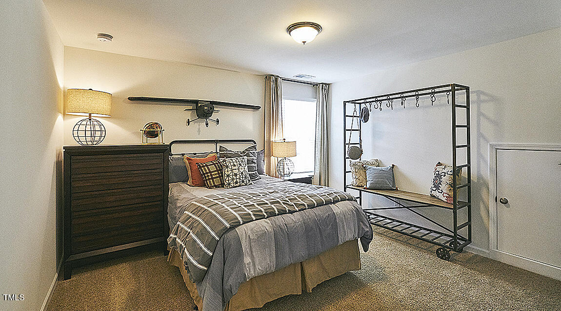 1733 Post Oak Drive Haw River, NC 27258 - Photo 26 of 26 a bedroom with a bed and a window