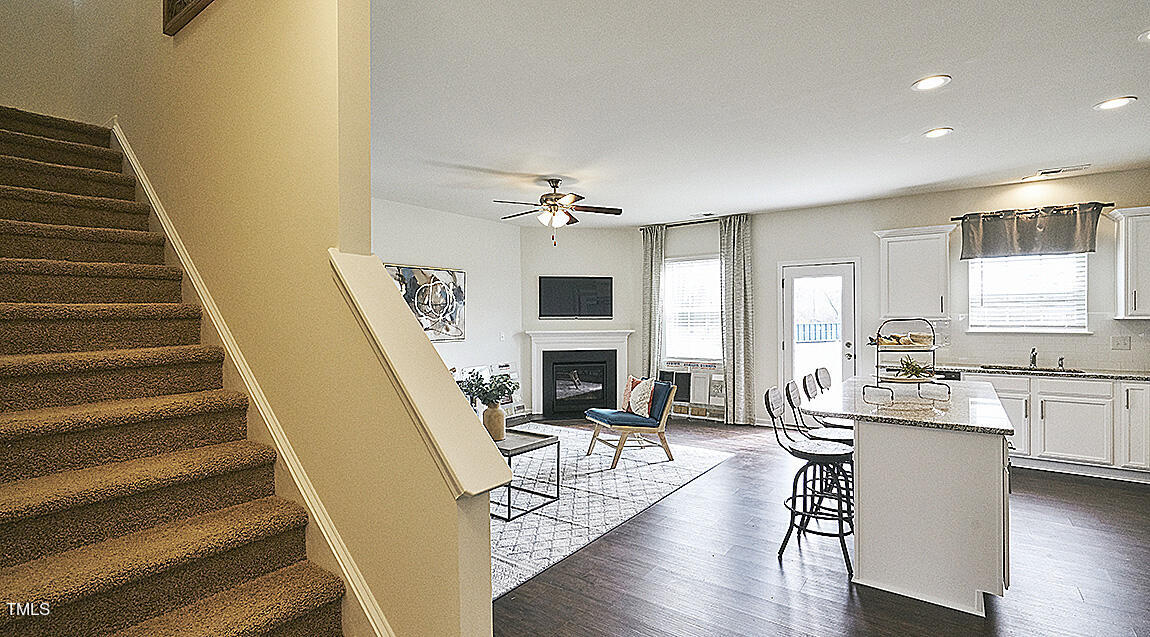 1733 Post Oak Drive Haw River, NC 27258 - Photo 3 of 26 a view of a livingroom with furniture fireplace wooden floor and windows