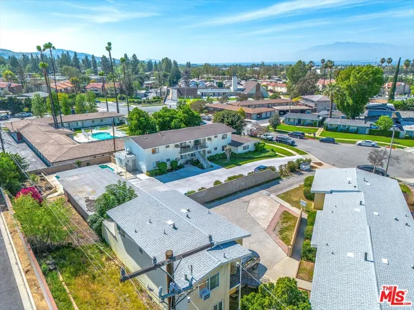 an aerial view of a house with a garden