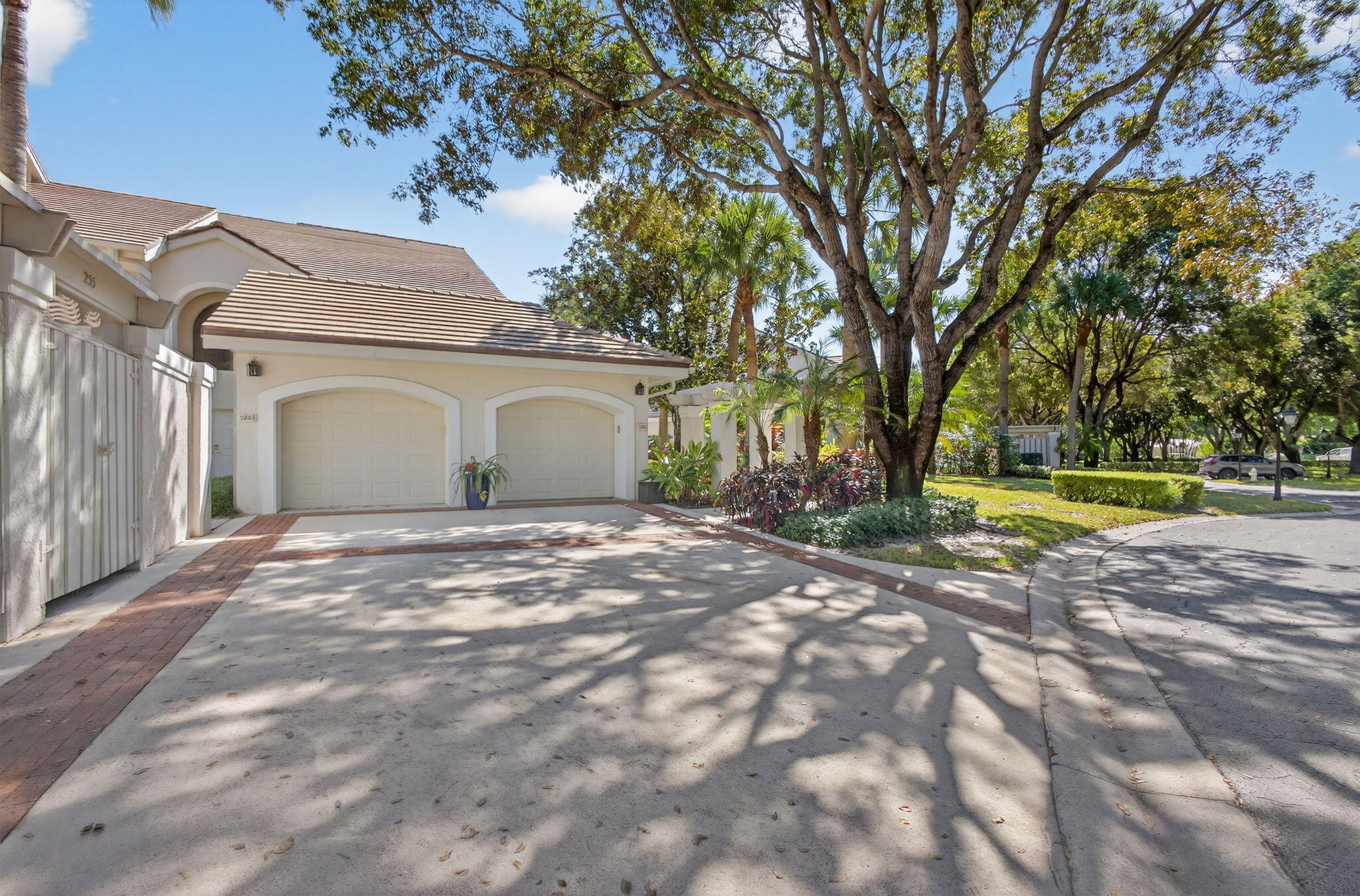 16050 West Bay Drive, Unit 155 Jupiter, FL 33477 - Photo 1 of 51 a view of a house with a yard and tree