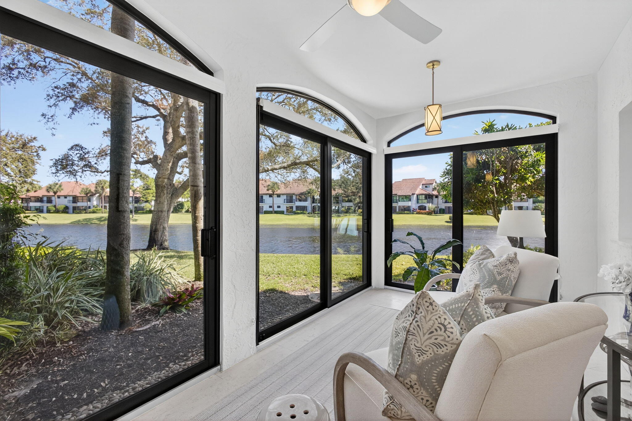 16050 West Bay Drive, Unit 155 Jupiter, FL 33477 - Photo 16 of 51 a bedroom with furniture and large windows