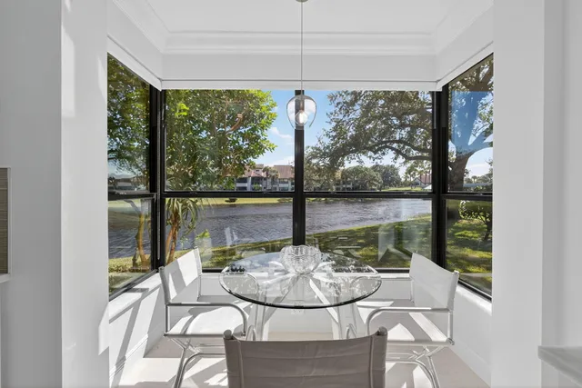 a view of a dining room with furniture window and outside view