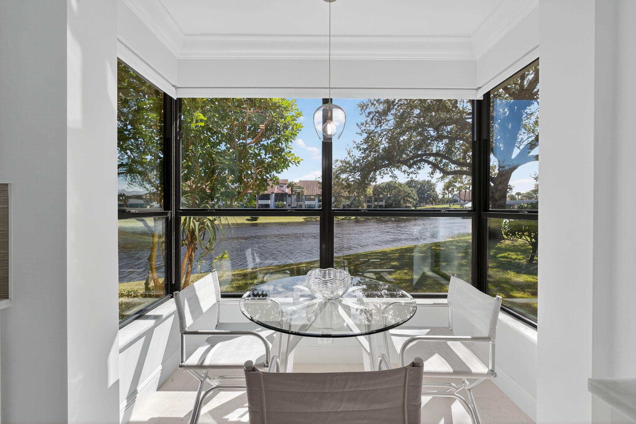 16050 West Bay Drive, Unit 155 Jupiter, FL 33477 - Photo 25 of 51 a view of a dining room with furniture window and outside view