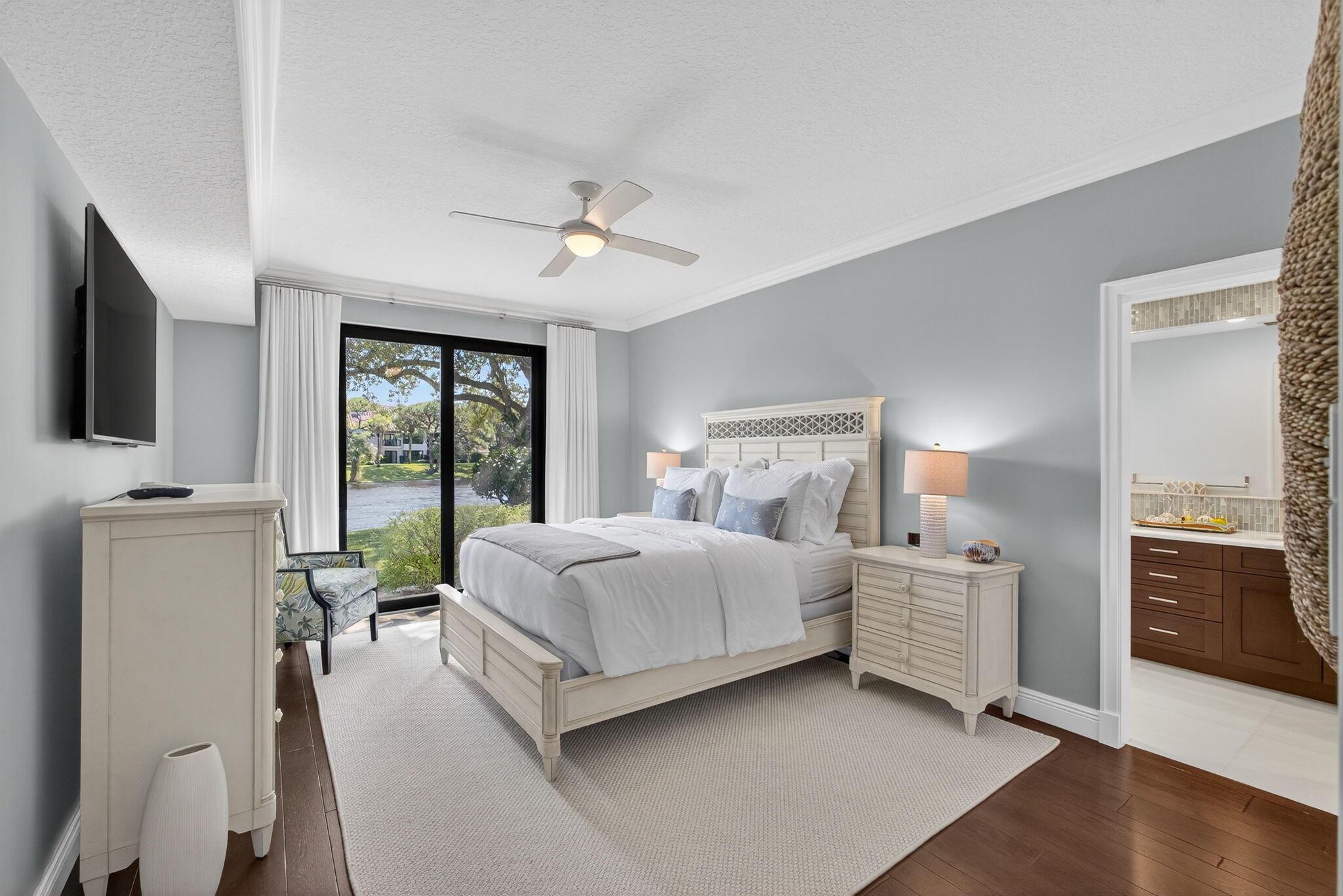 16050 West Bay Drive, Unit 155 Jupiter, FL 33477 - Photo 30 of 51 a bed room with a bed and a television