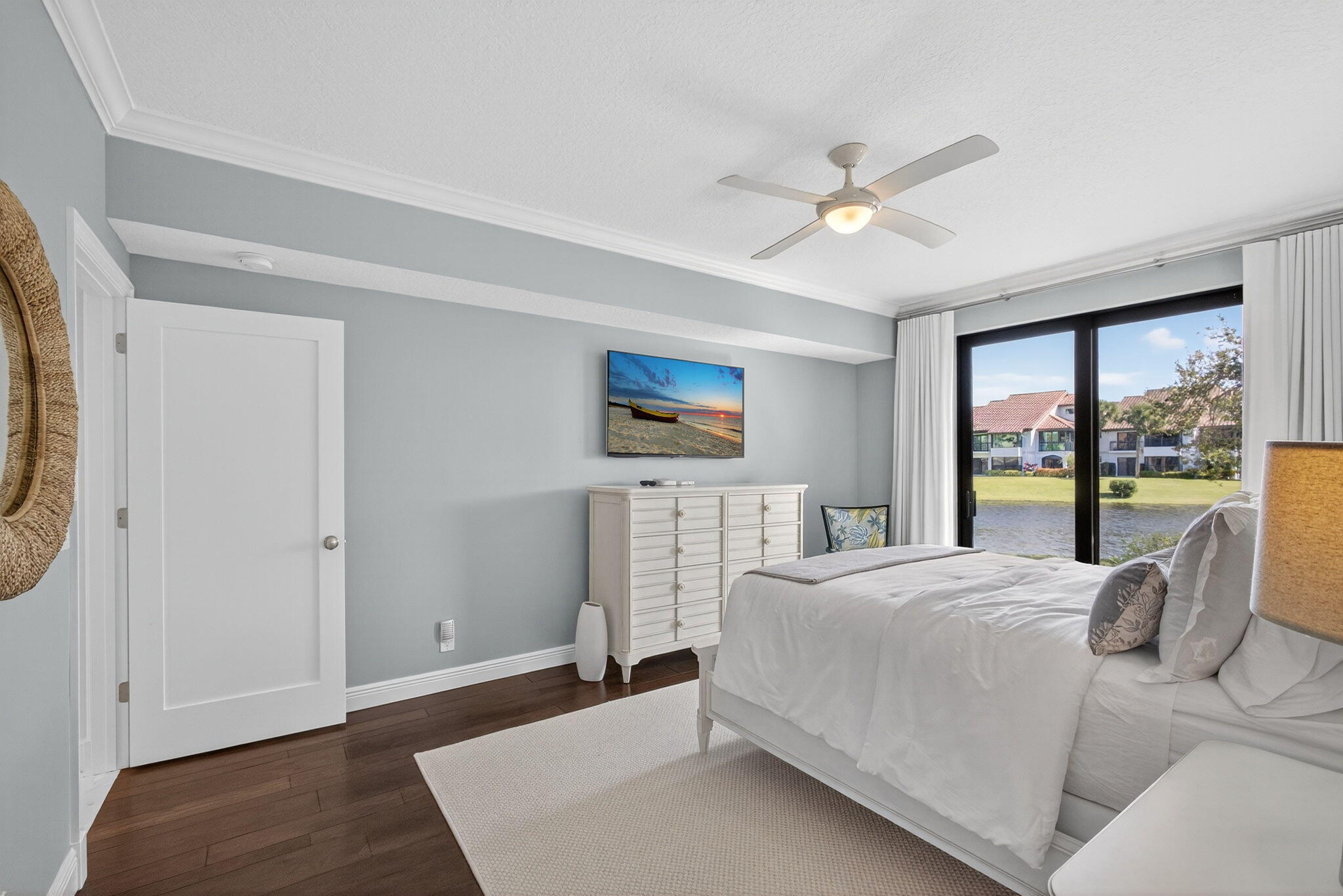 16050 West Bay Drive, Unit 155 Jupiter, FL 33477 - Photo 31 of 51 a bedroom with a large bed and a window