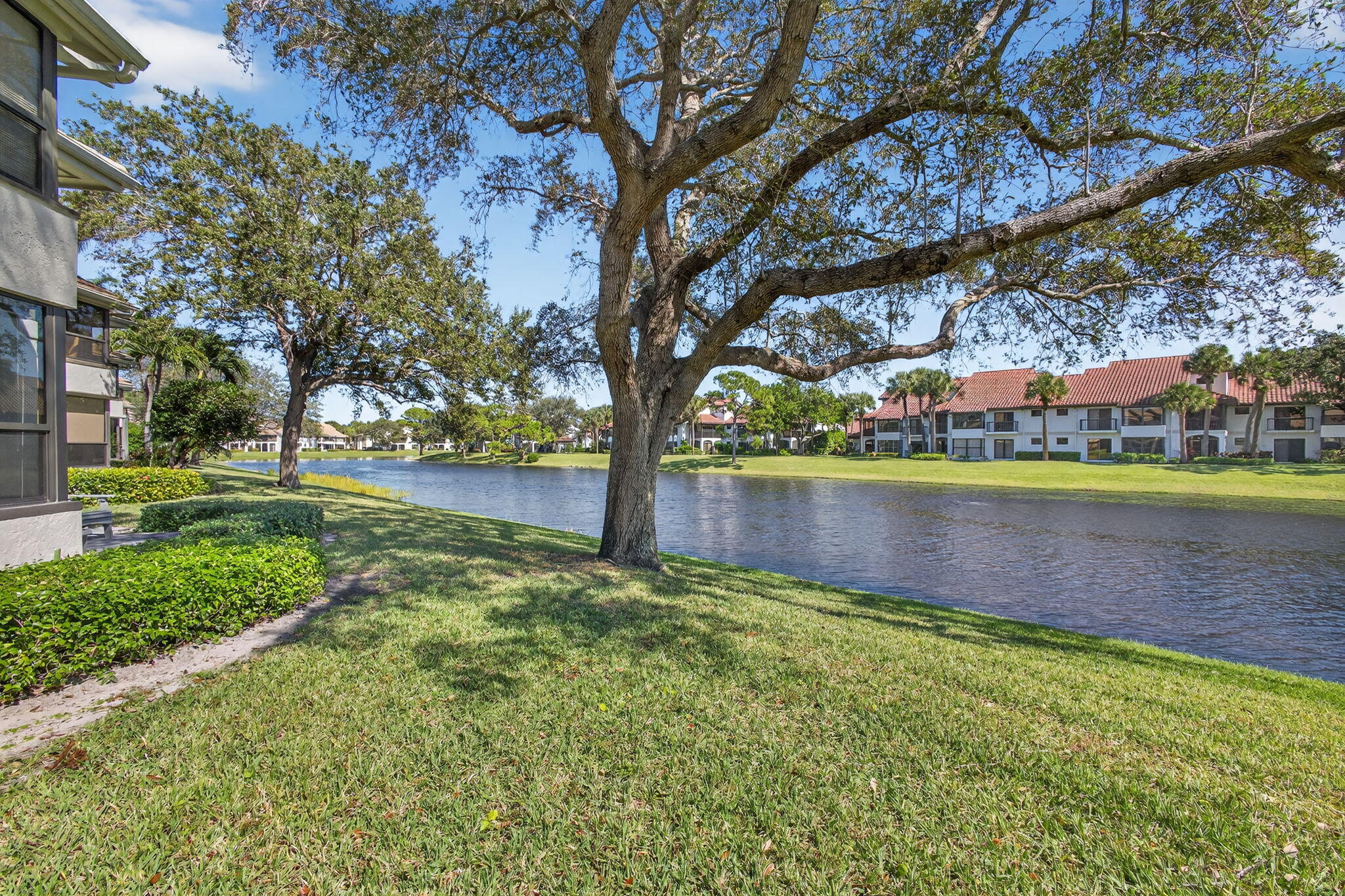 16050 West Bay Drive, Unit 155 Jupiter, FL 33477 - Photo 41 of 51 a view of a lake with houses