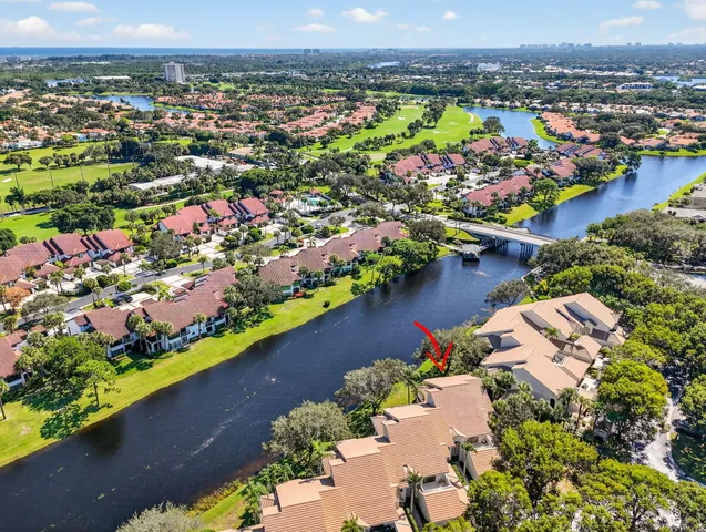 an aerial view of a house with a lake view