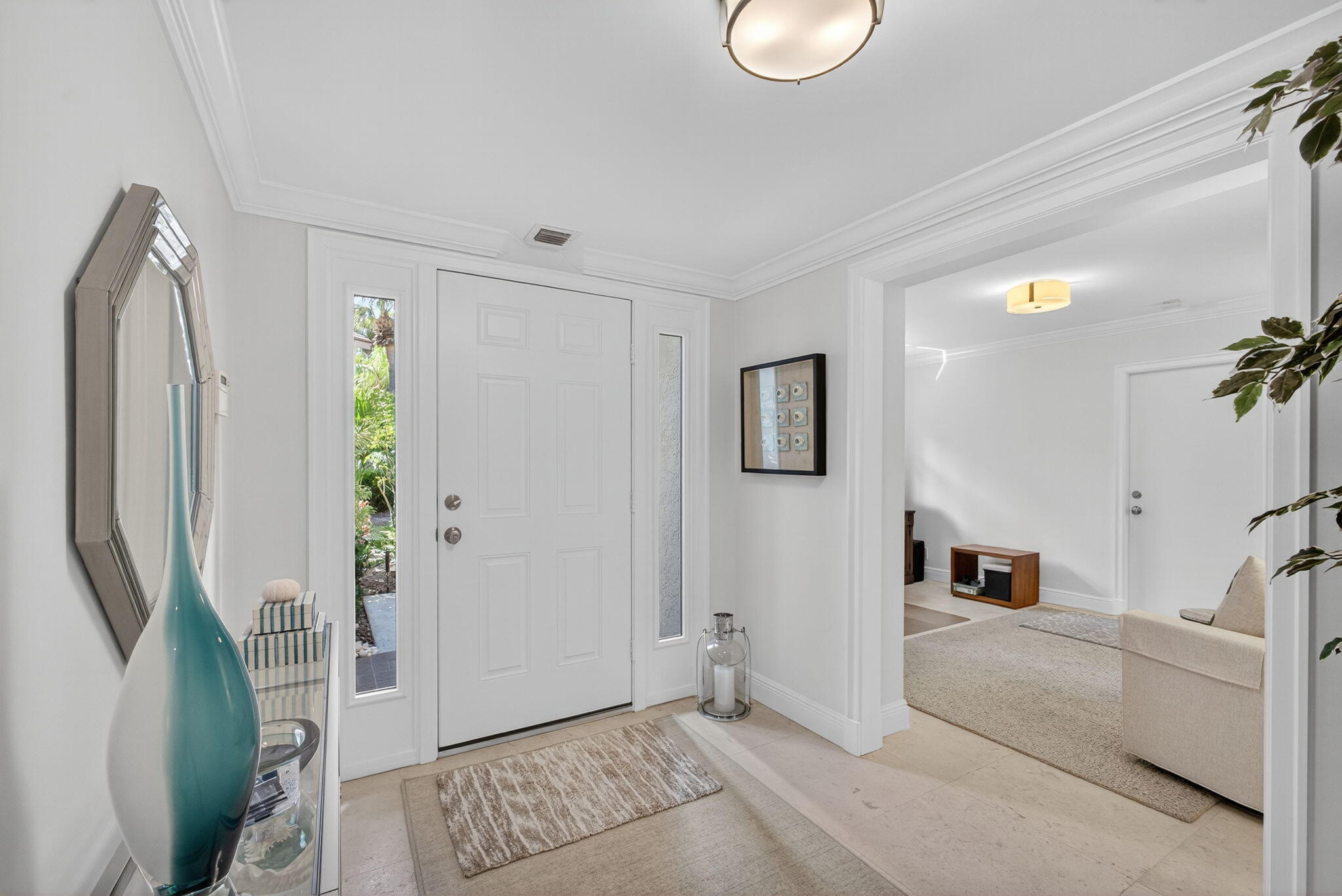 16050 West Bay Drive, Unit 155 Jupiter, FL 33477 - Photo 5 of 51 a living room with furniture and a rug