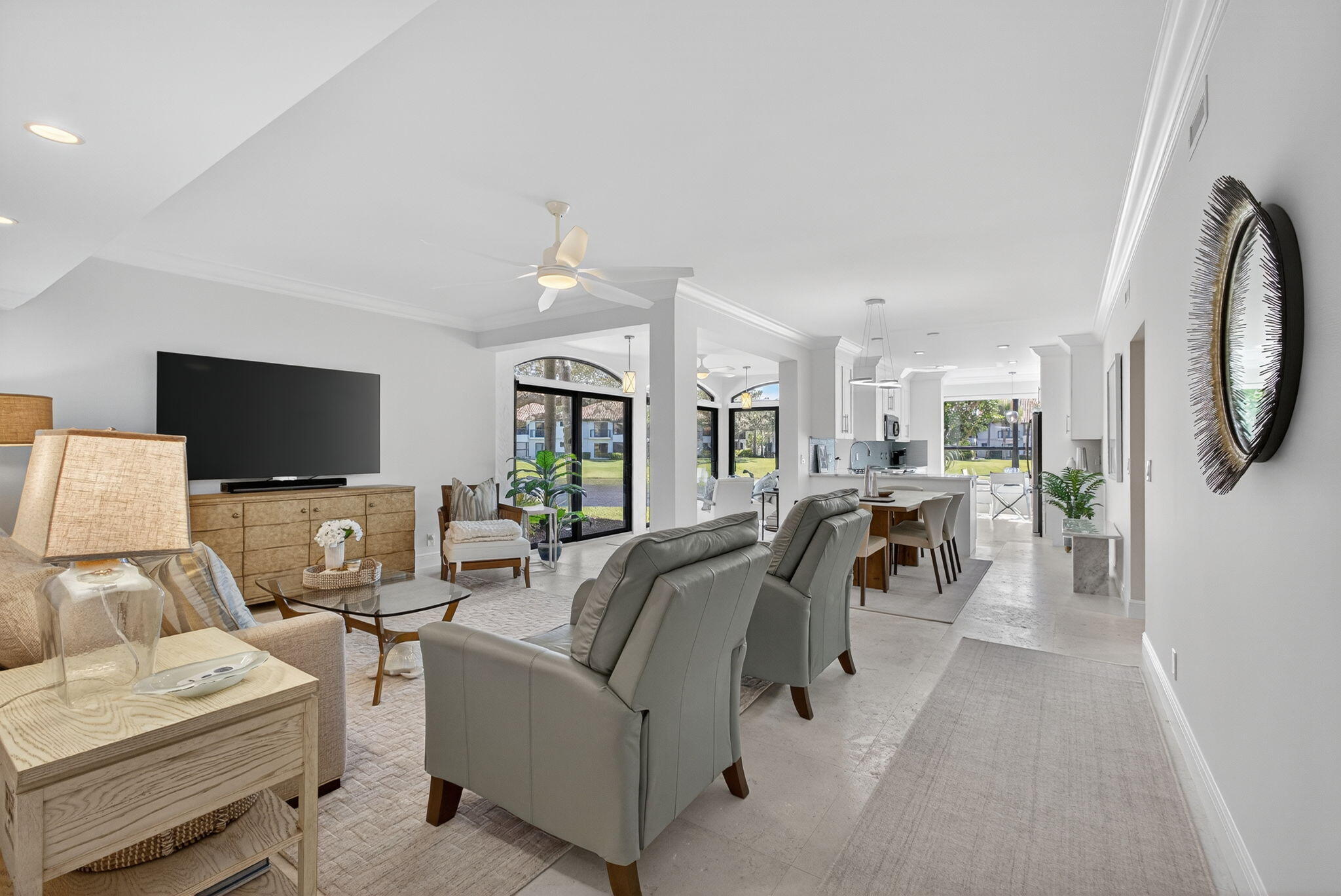 16050 West Bay Drive, Unit 155 Jupiter, FL 33477 - Photo 9 of 51 a living room with furniture and a flat screen tv