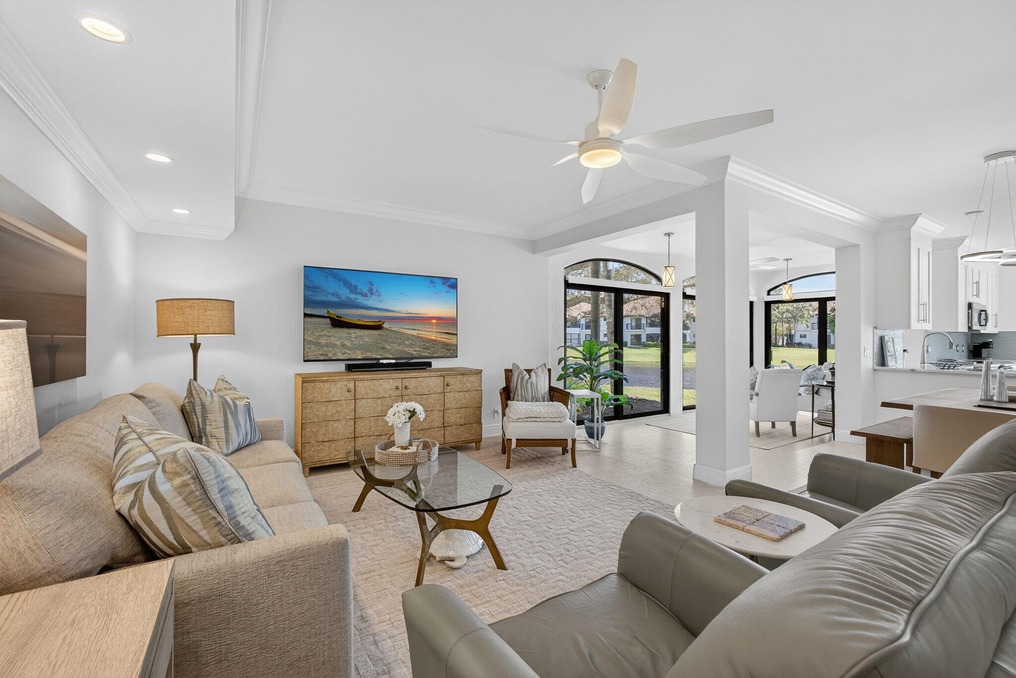 16050 West Bay Drive, Unit 155 Jupiter, FL 33477 - Photo 10 of 51 a living room with furniture and a flat screen tv