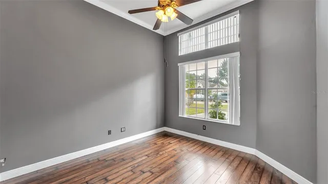 a kitchen with a sink refrigerator and cabinets