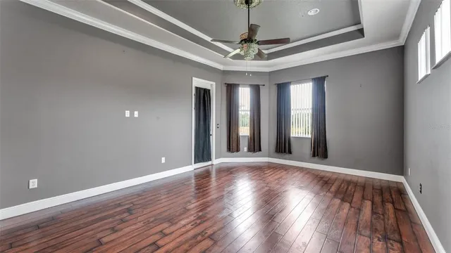 a bathroom with a granite countertop toilet and a shower