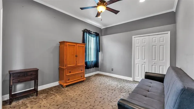 an aerial view of a house with a garden and lake view