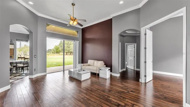a kitchen with kitchen island granite countertop a sink stove and refrigerator