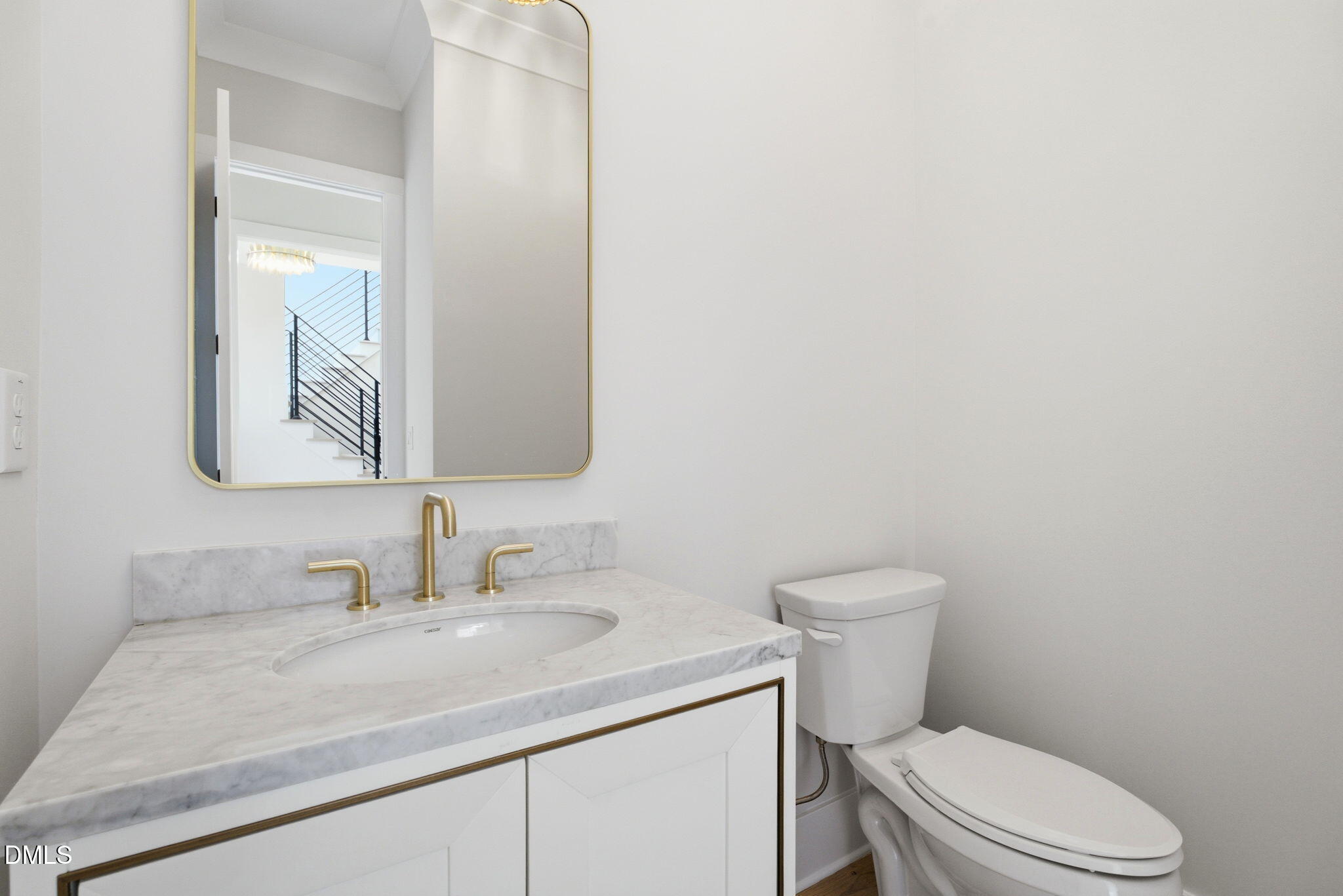 1304 Sanctuary Pond Drive Raleigh, NC 27606 - Photo 27 of 52 a bathroom with a granite countertop toilet sink and mirror