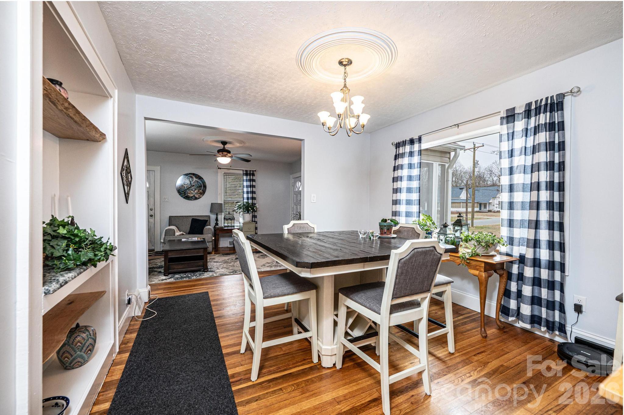 235 Spring Street Mocksville, NC 27028 - Photo 11 of 41 a view of a dining room with furniture window and wooden floor