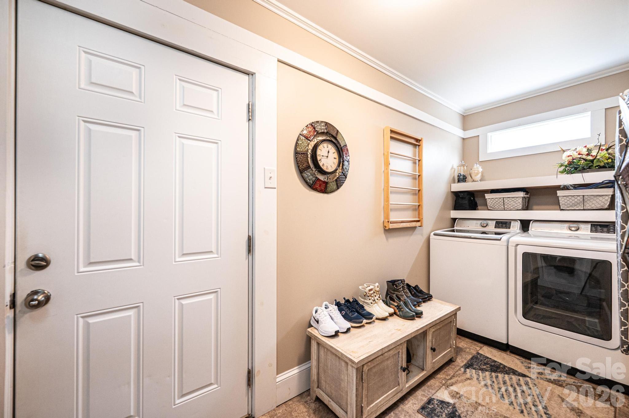 235 Spring Street Mocksville, NC 27028 - Photo 16 of 41 a view of a livingroom with washer and dryer