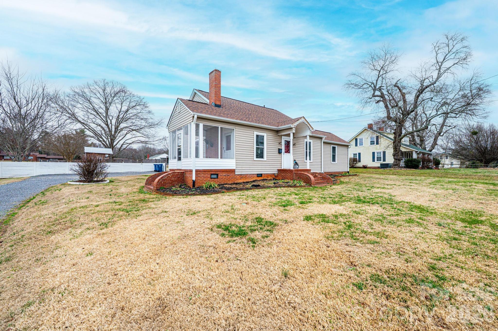 235 Spring Street Mocksville, NC 27028 - Photo 2 of 41 a front view of a house with a yard covered with snow