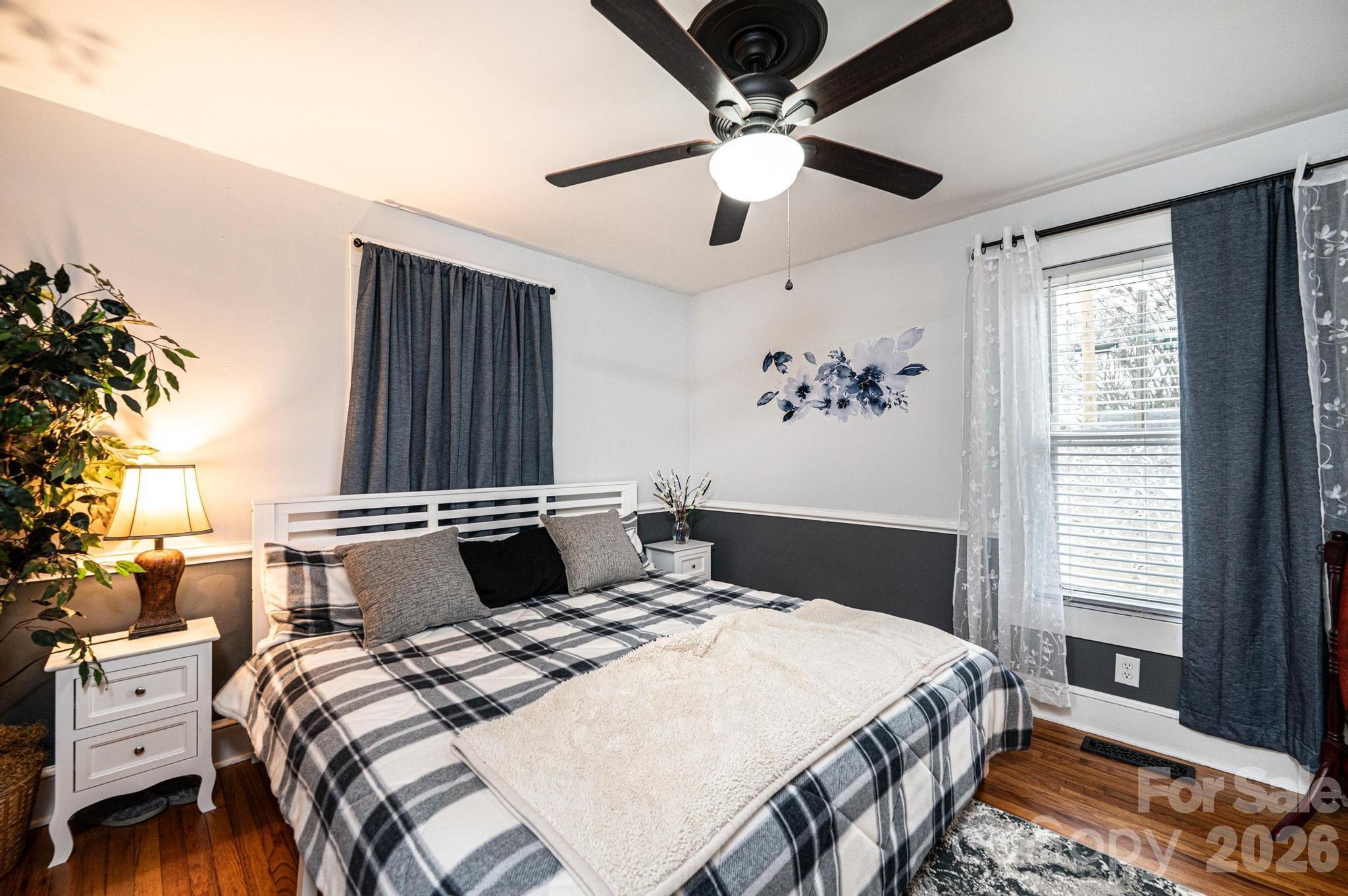 235 Spring Street Mocksville, NC 27028 - Photo 25 of 41 a bedroom with a large bed and a window
