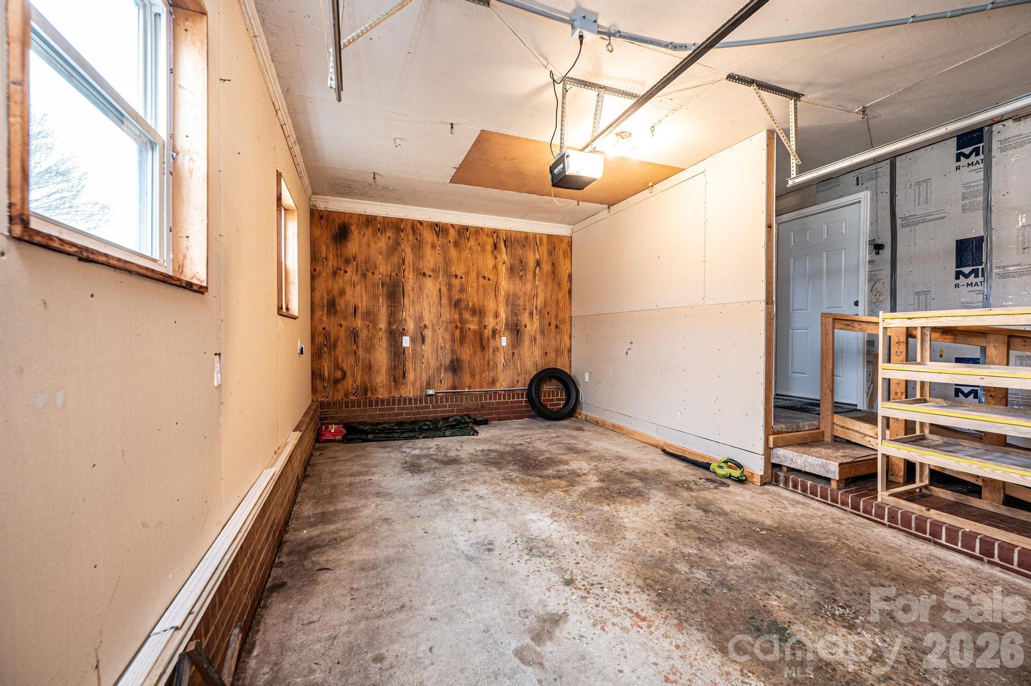235 Spring Street Mocksville, NC 27028 - Photo 27 of 41 a view of a porch with wooden floor and iron stairs