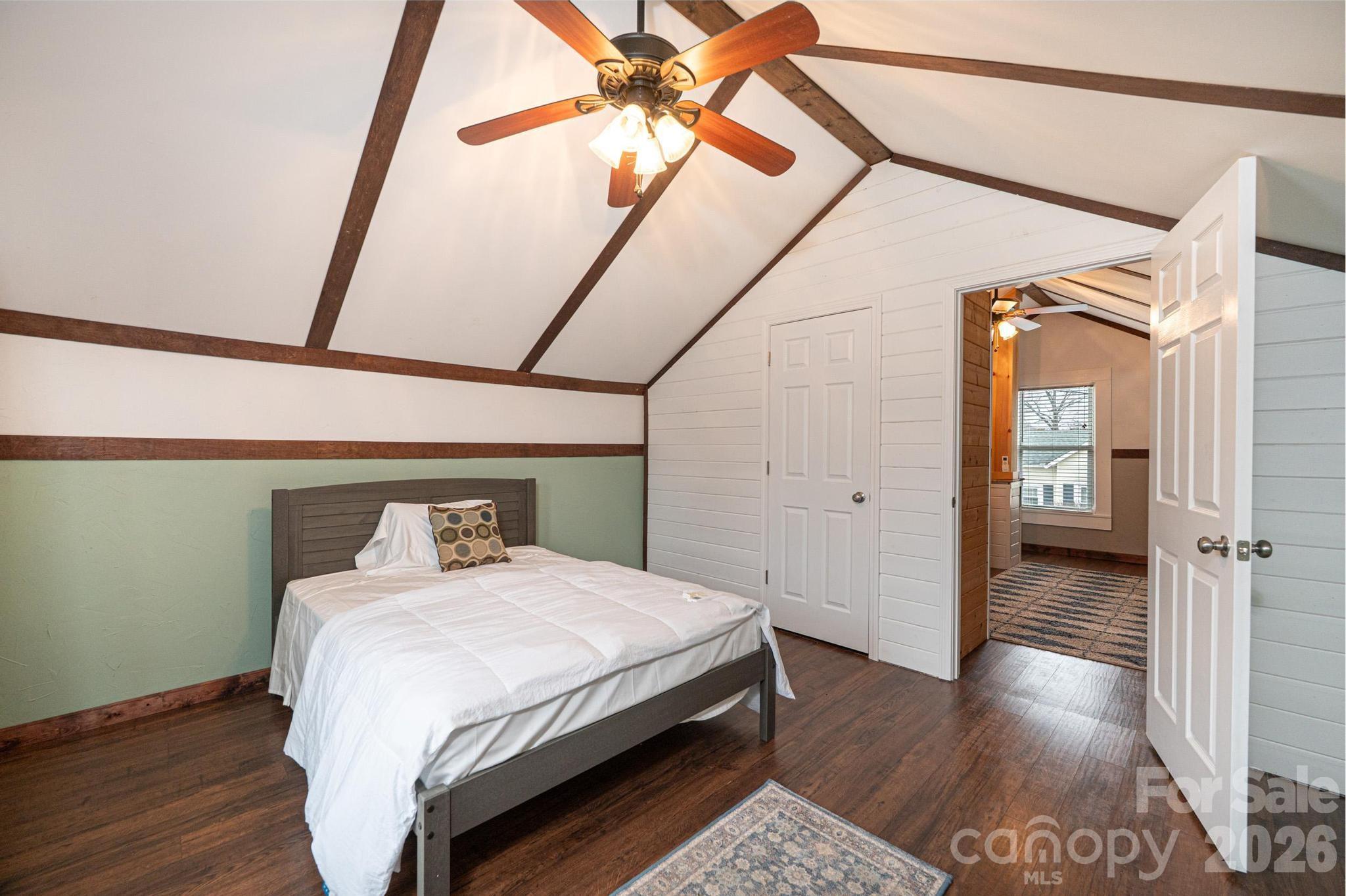 235 Spring Street Mocksville, NC 27028 - Photo 35 of 41 a bedroom with a bed and wooden floor