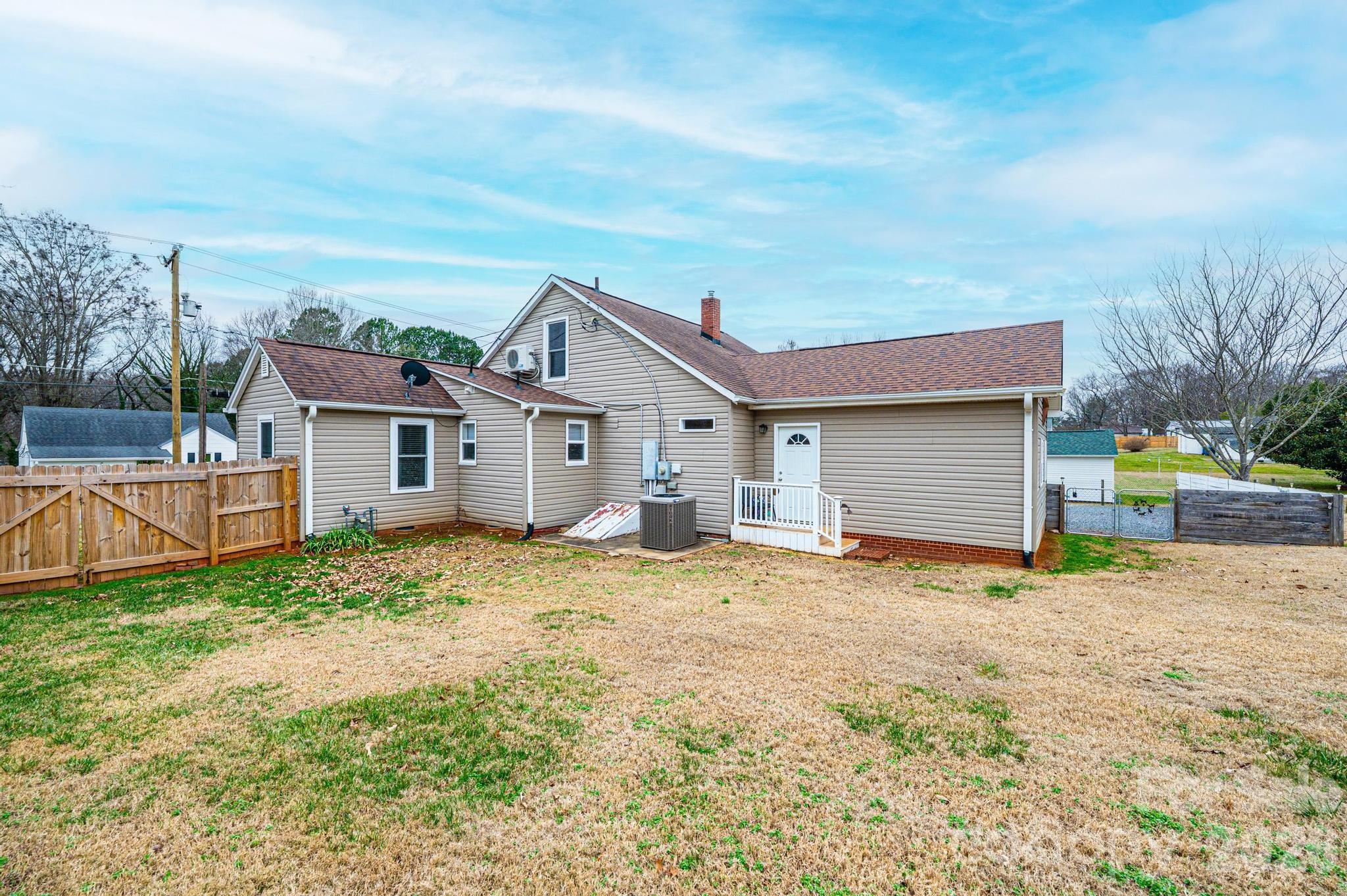 235 Spring Street Mocksville, NC 27028 - Photo 38 of 41 a view of a house with backyard and trees