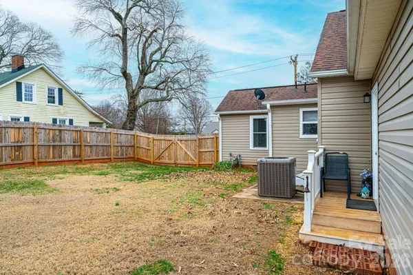 a view of a yard with a house in the background