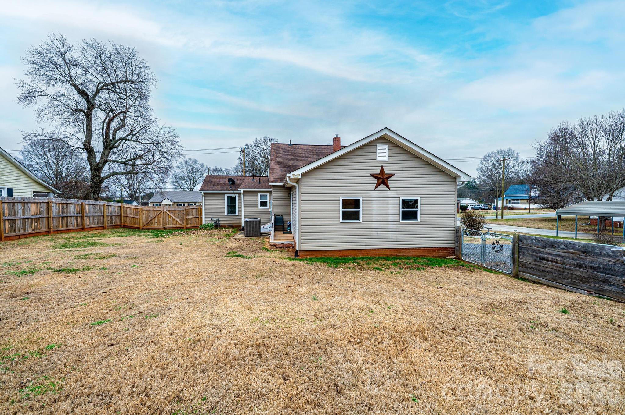235 Spring Street Mocksville, NC 27028 - Photo 4 of 41 a view of a house with backyard and sitting area