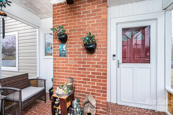 a view of a door and chair front of the house
