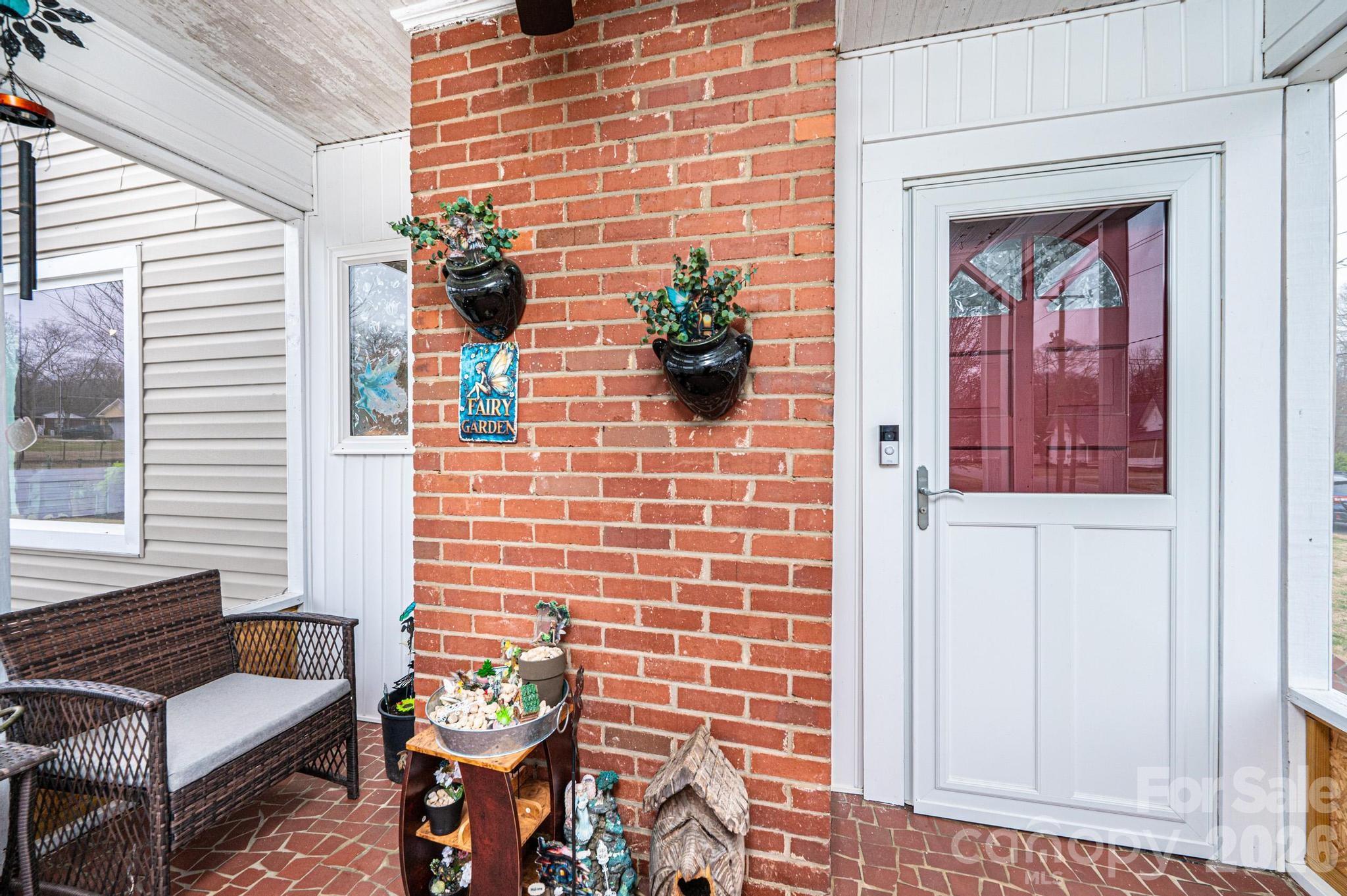 235 Spring Street Mocksville, NC 27028 - Photo 6 of 41 a view of a door and chair front of the house
