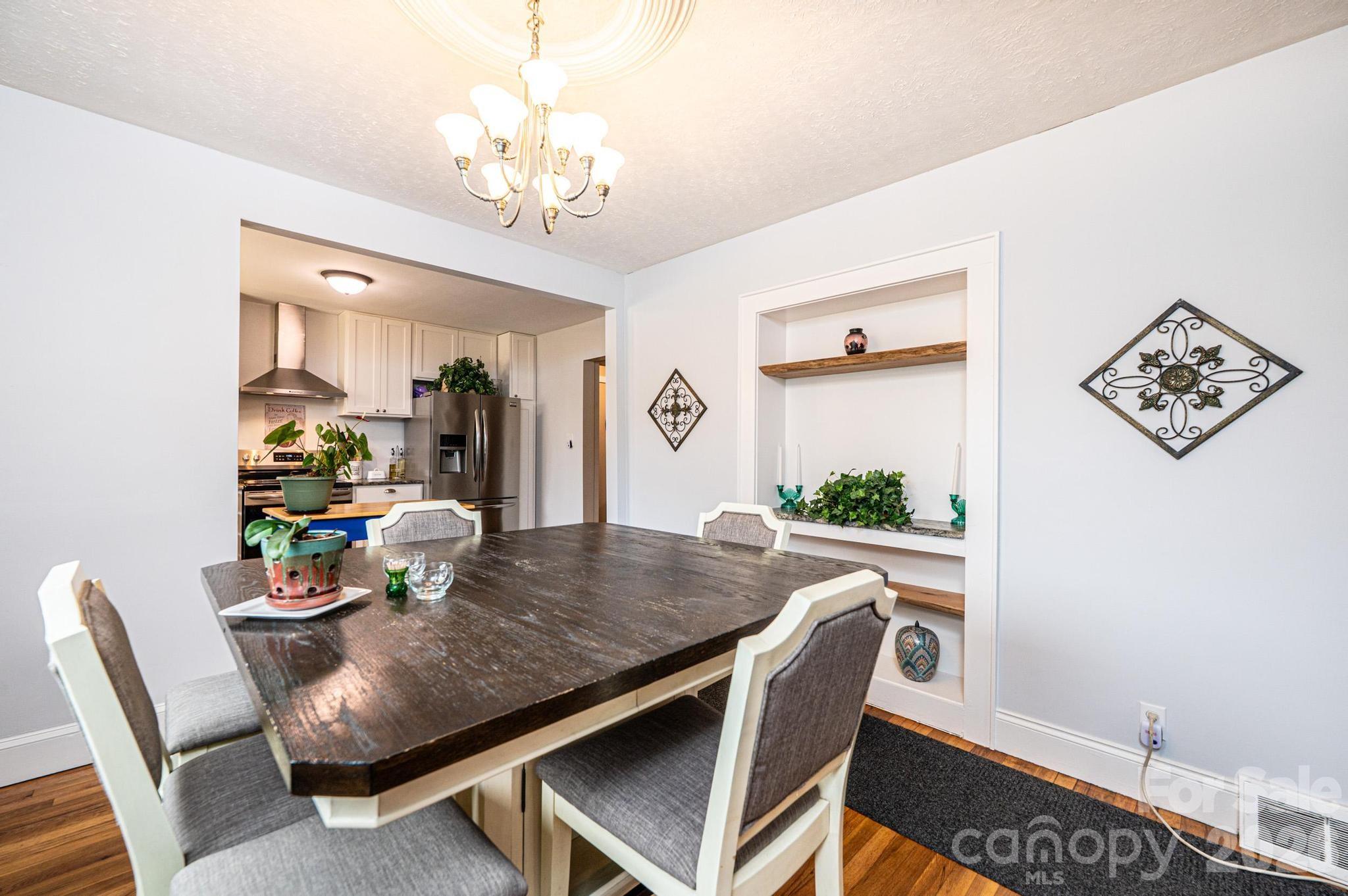 235 Spring Street Mocksville, NC 27028 - Photo 9 of 41 a view of a dining room with furniture and a chandelier