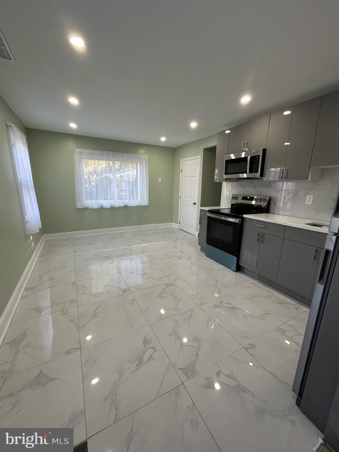 1420 Williams Avenue Levittown, PA 19057 - Photo 3 of 15 a large kitchen with stainless steel appliances a large counter top