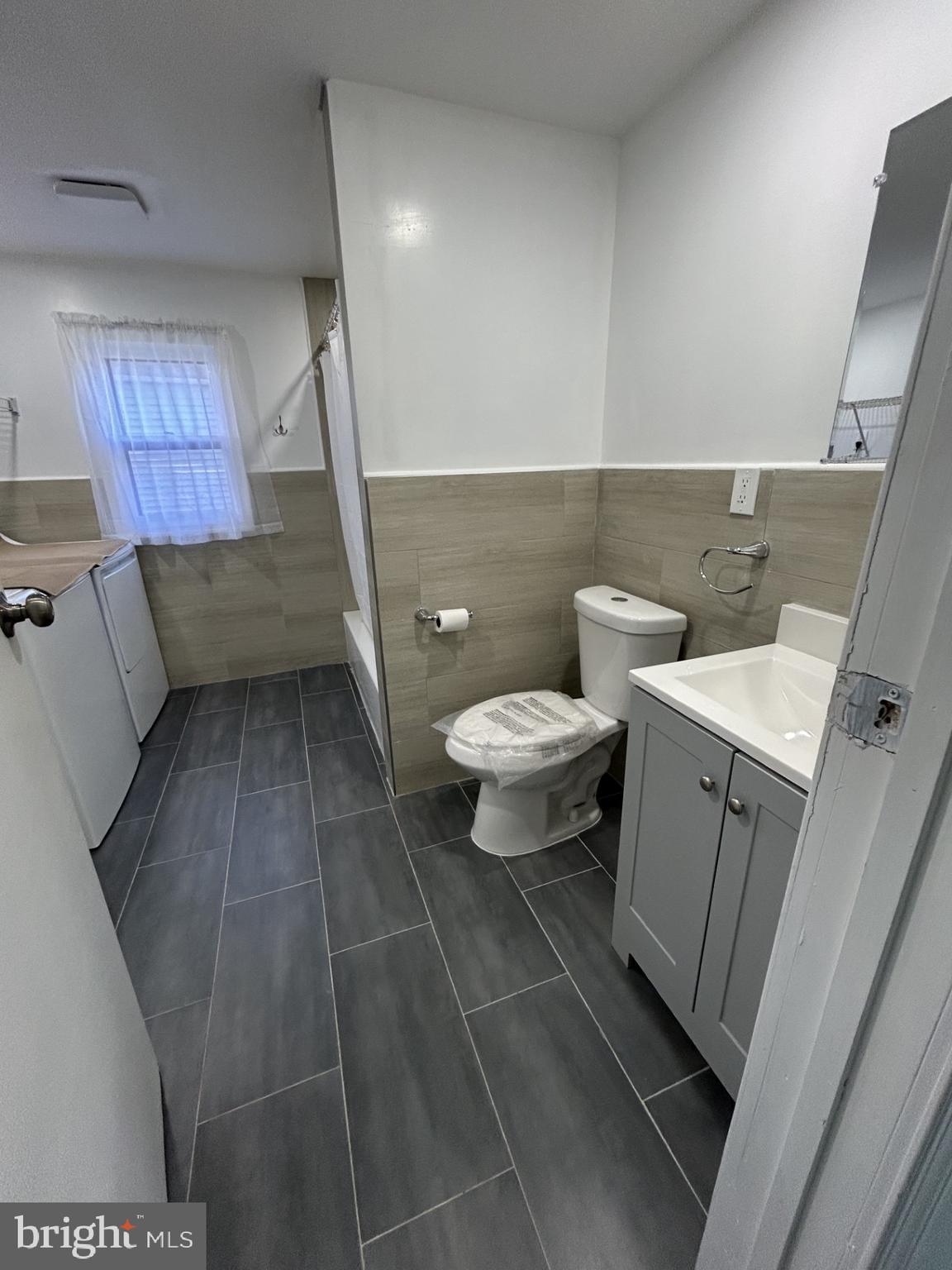 1420 Williams Avenue Levittown, PA 19057 - Photo 6 of 15 a bathroom with a sink and a mirror