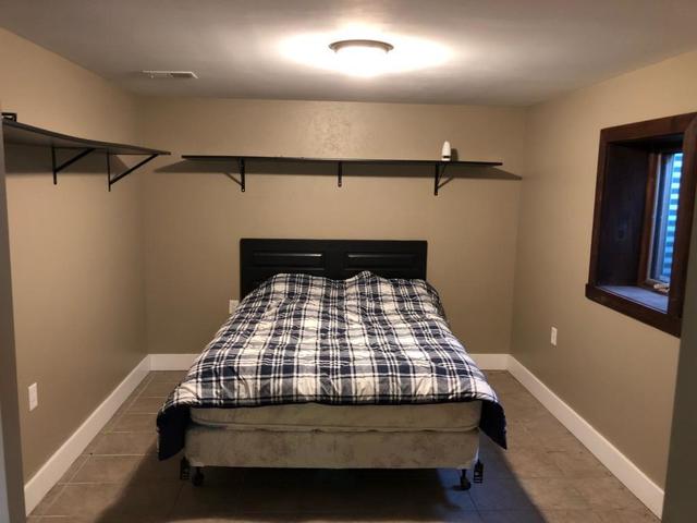 8420 South Main Street Rochelle, IL 61068 - Photo 23 of 24 a bedroom with a bed and window