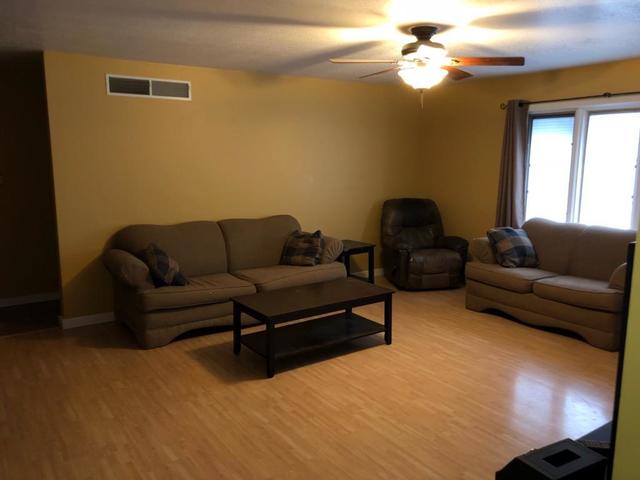8420 South Main Street Rochelle, IL 61068 - Photo 5 of 24 a living room with furniture and a window