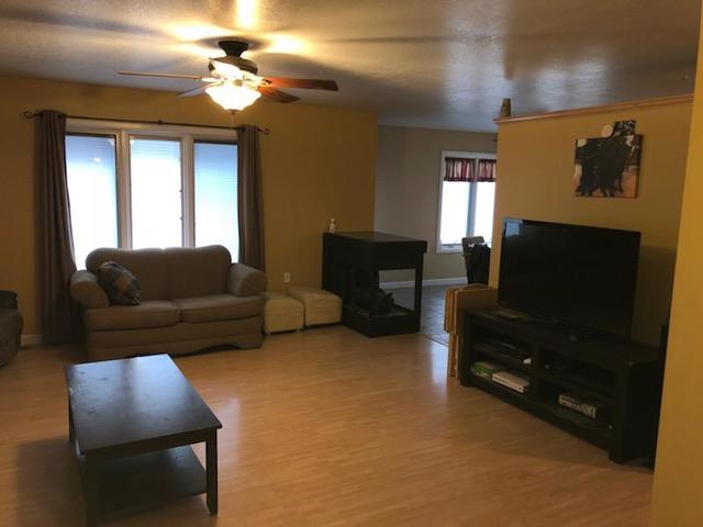 8420 South Main Street Rochelle, IL 61068 - Photo 6 of 24 a living room with furniture and a flat screen tv