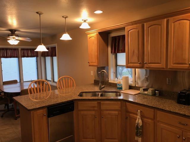 8420 South Main Street Rochelle, IL 61068 - Photo 7 of 24 a kitchen with a sink cabinets and window