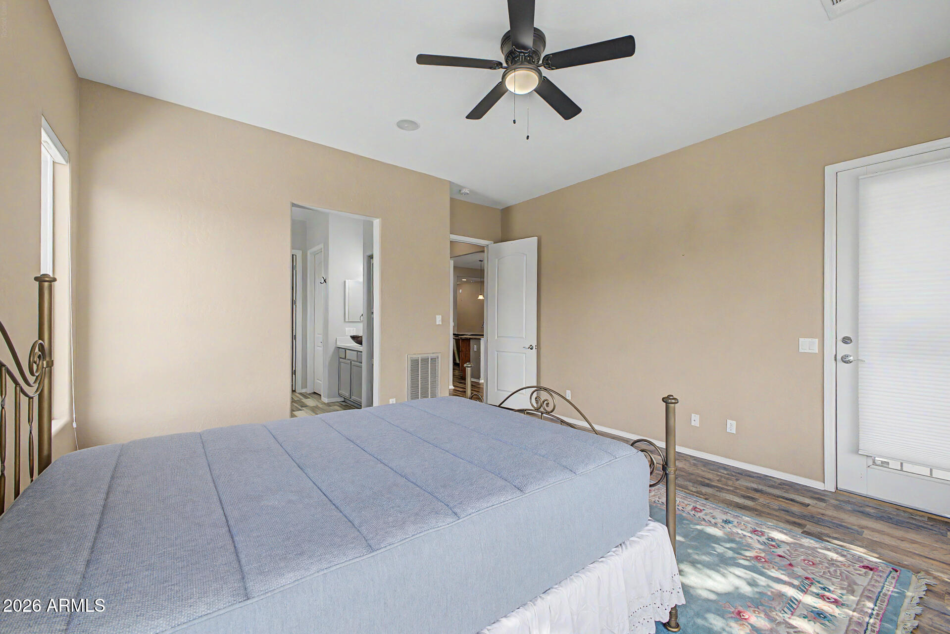 5090 South Ranger Trail Gilbert, AZ 85298 - Photo 16 of 50 a bedroom with a large bed and a chandelier