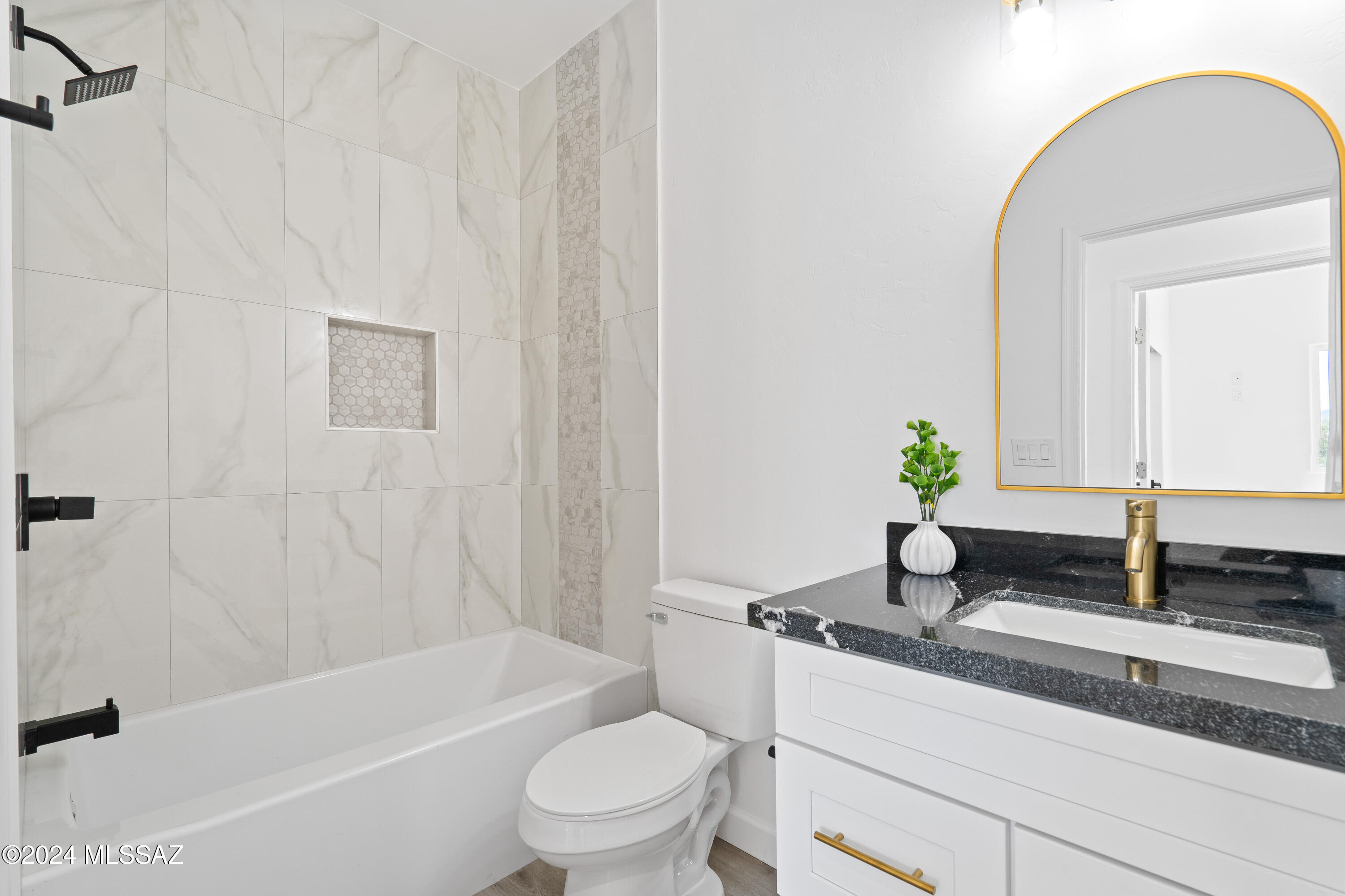 1874 Circulo Colombia Rio Rico, AZ 85648 - Photo 18 of 31 a bathroom with a granite countertop bathtub sink vanity mirror and toilet